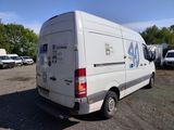 a white van that is parked in a lot