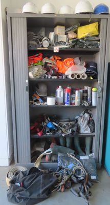 a metal cabinet with a bunch of items on it