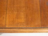 a close up of a wooden table with a white background