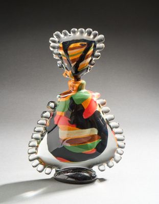 a glass bottle that has a colorful design on it