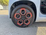 a close up of a tire on a small car