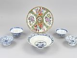 a group of blue and white dishes and bowls