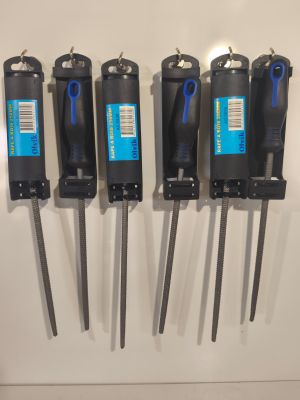 four black and blue tools are hanging on a wall