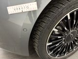 a close up of a car tire with a sticker on it