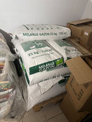 many bags of food sitting on a bed in a room