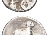 an image of a silver coin with a picture of a man and a dog on it