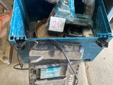 a blue tool box with a drill and a hammer in it