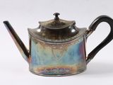 a silver tea pot with a handle on a white background