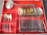 a red box with silverware and spoons in it