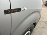 a close up of a car door with a sticker on it