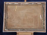 an old wooden easel with a painting on top of it