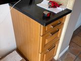 a small desk with a computer on top of it