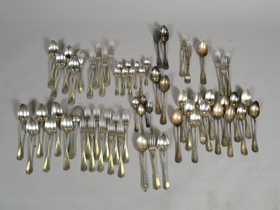 a lot of silver spoons and forks on the table