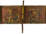 peinture sur le mur d'un lit à cadre en bois, sur lequel est représenté un tableau représentant des personnes
