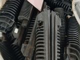 a lot of different types of hoses laying on the ground