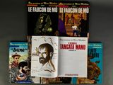 several books on a shelf with a drawing of a man and a woman