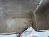 a dirty white box with a cloth in it
