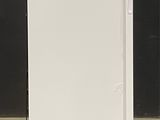 a white refrigerator that is sitting on the floor