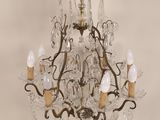 a chandelier with many lights hanging from it ' s ceiling
