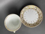 an image of a cup and saucer sitting on top of a table