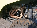 a close up of the front of a vehicle with a tire