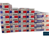 boxes of cigarettes stacked on top of each other on a white surface