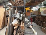 a large amount of wood on the shelves in the warehouse