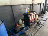 an image of a garage with a work bench and tools