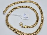 a gold plated chain with a clasp on a white background
