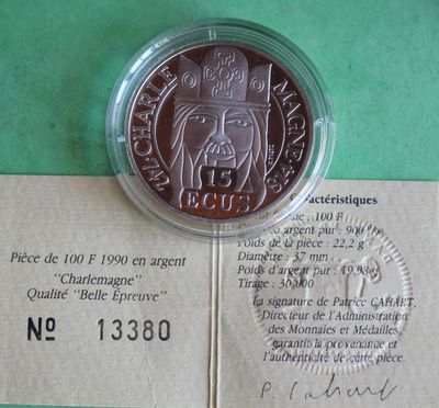 a picture of a piece of paper with a coin on it
