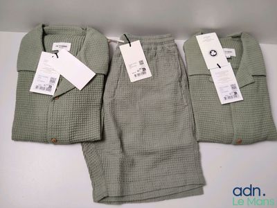 two pairs of men ' s pants with tags on them