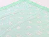 a green cloth with white letters on it
