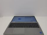 an apple laptop computer sitting on top of a white table