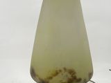 a close up of a lamp on a table with a white background