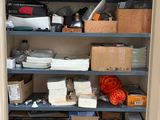 a cabinet with many items in it in a room