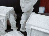several pieces of art are sitting on top of a table