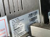 a close up of a machine with labels on the side of it