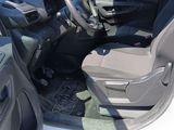 the interior of a car with the driver ' s seat folded down
