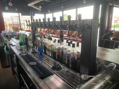 a bar with a lot of bottles of alcohol on it