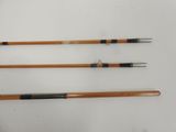 three different types of fishing rods on a white surface