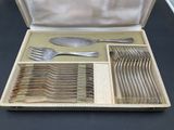 a box with silverware in it on a table