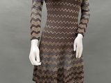 a mannequin wearing a brown and black dress on a mannequin mannequin