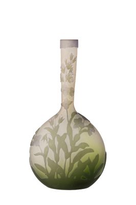 a green vase with white flowers on it on a white background