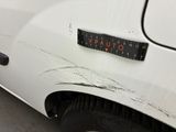 a sticker on the side of a white car