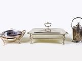 three pieces of silverware including a silver plate and a silver bowl