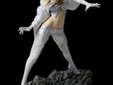 a close up of a statue of a woman on a rock