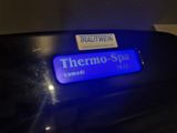 thermo spa is located on the back of a black car