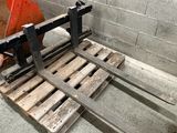 a pallet that is sitting on the floor next to a brick wall