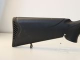 the rifle is sitting on the table ready to be used