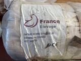 a roll of fabric wrapped in plastic on a table